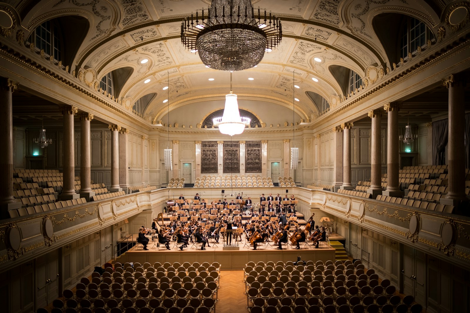 Classical orchestra in an ornate concert hall
