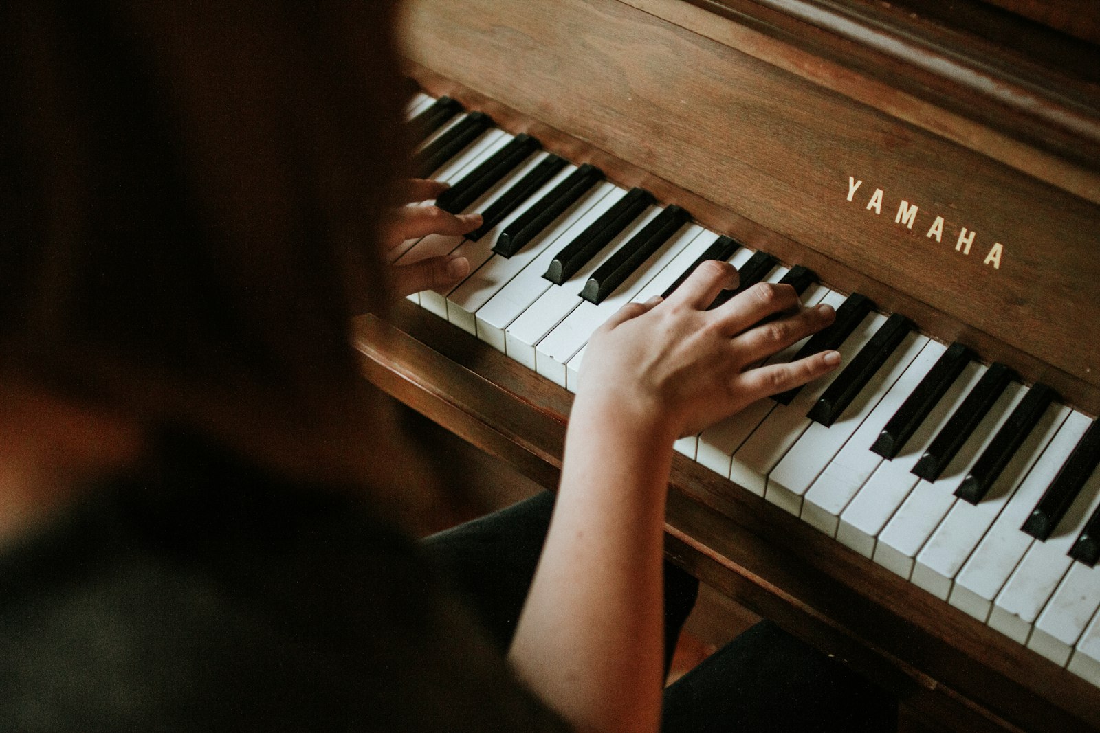 Pianist at a Yamaha piano during an intimate recital